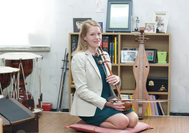 Professor Finchum-Sung is playing her haegeum, Korean traditional instrument