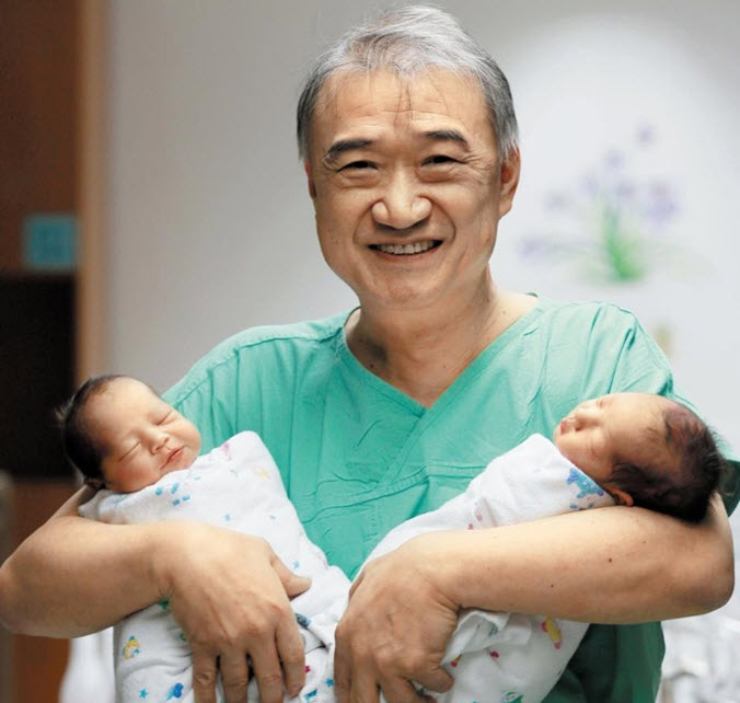 Professor Jun and a twin he helped deliver
