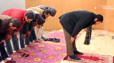 Muslim students are praying at the newly made prayer room