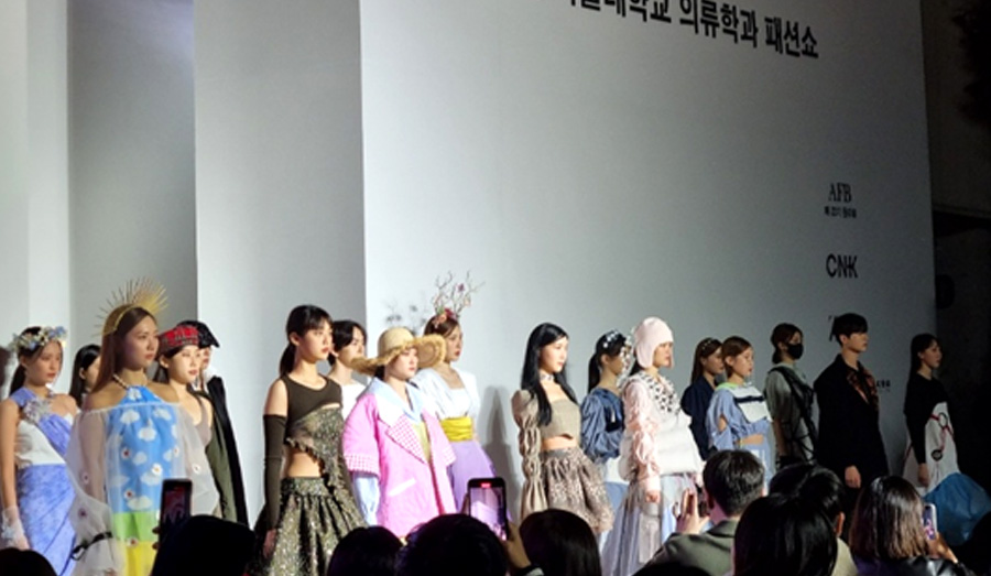Models wearing costumes made by student designers