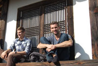 students sitting in a traditional house