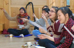 students learning traditional songs